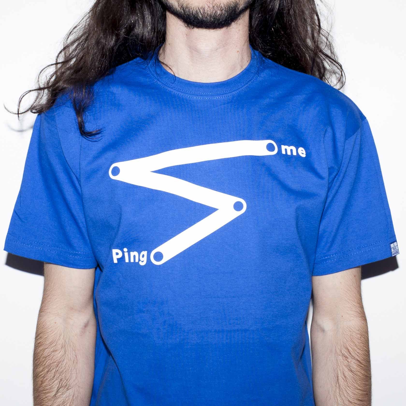 Royal blue T-shirt with funny computer nerd network geek joke about pinging someone screen printed in white on the front. A saw tooth line with Ping and Me at either end.